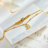 1344f47c-f28f-45b4-9587-c24d6bc3dc8c.jpg Boho Heart Tassel Anklet – Double Layer Chain