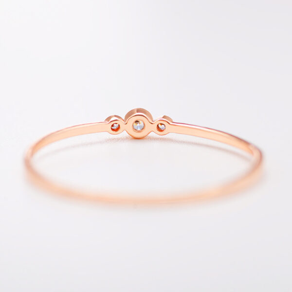 Three diamond copper zircon joint rings